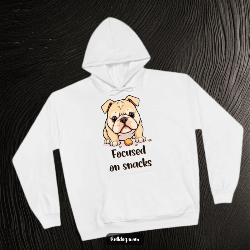 Funny hoodie featuring a bulldog with an intense gaze locked onto a dropped treat, symbolizing unwavering focus and desire.