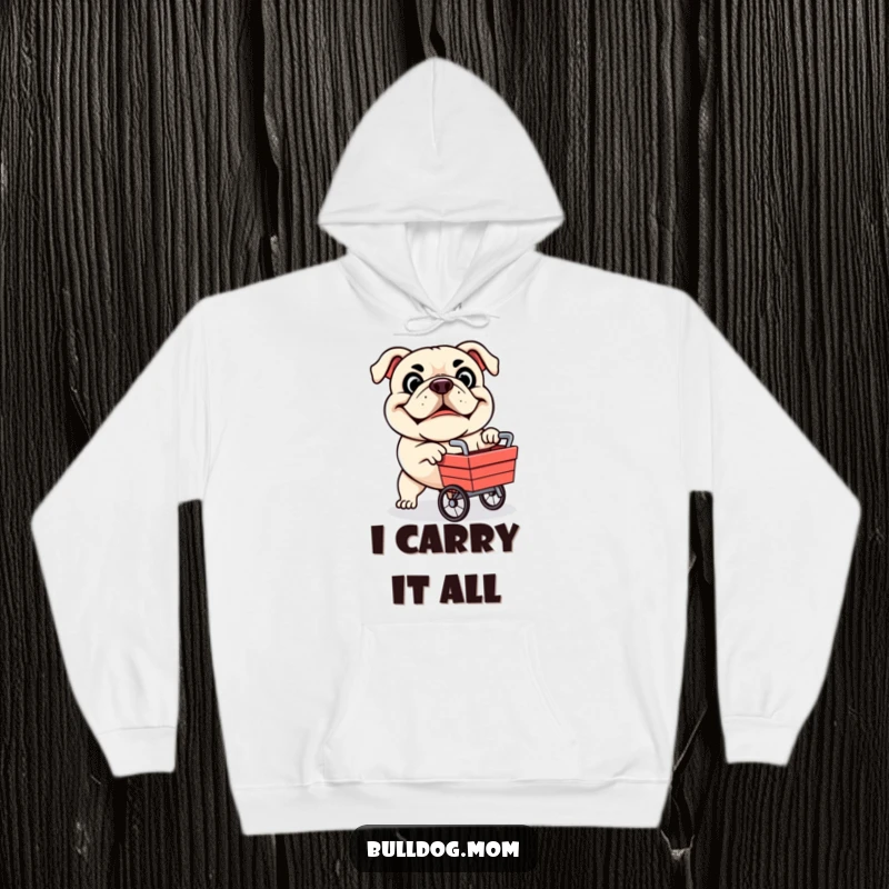 Funny hoodie displaying a determined bulldog mascot joyfully pushing a miniature cart, capturing a moment of delightful ambition.