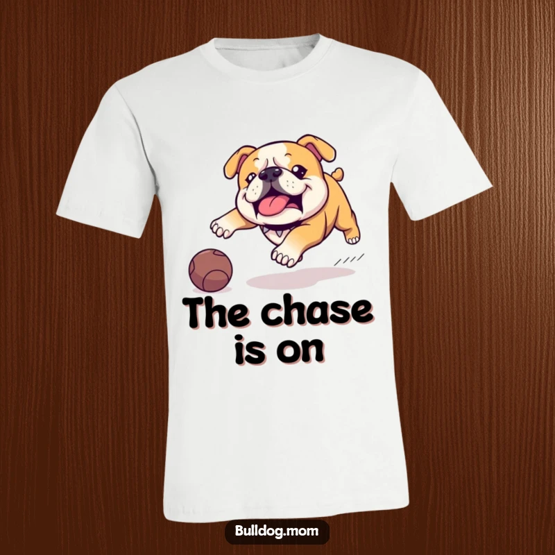 Funny Kawaii Bulldog t-shirt, depicting a dog in a classic waddle, enthusiastically chasing a slightly-too-big ball, a comical scene of pursuit.